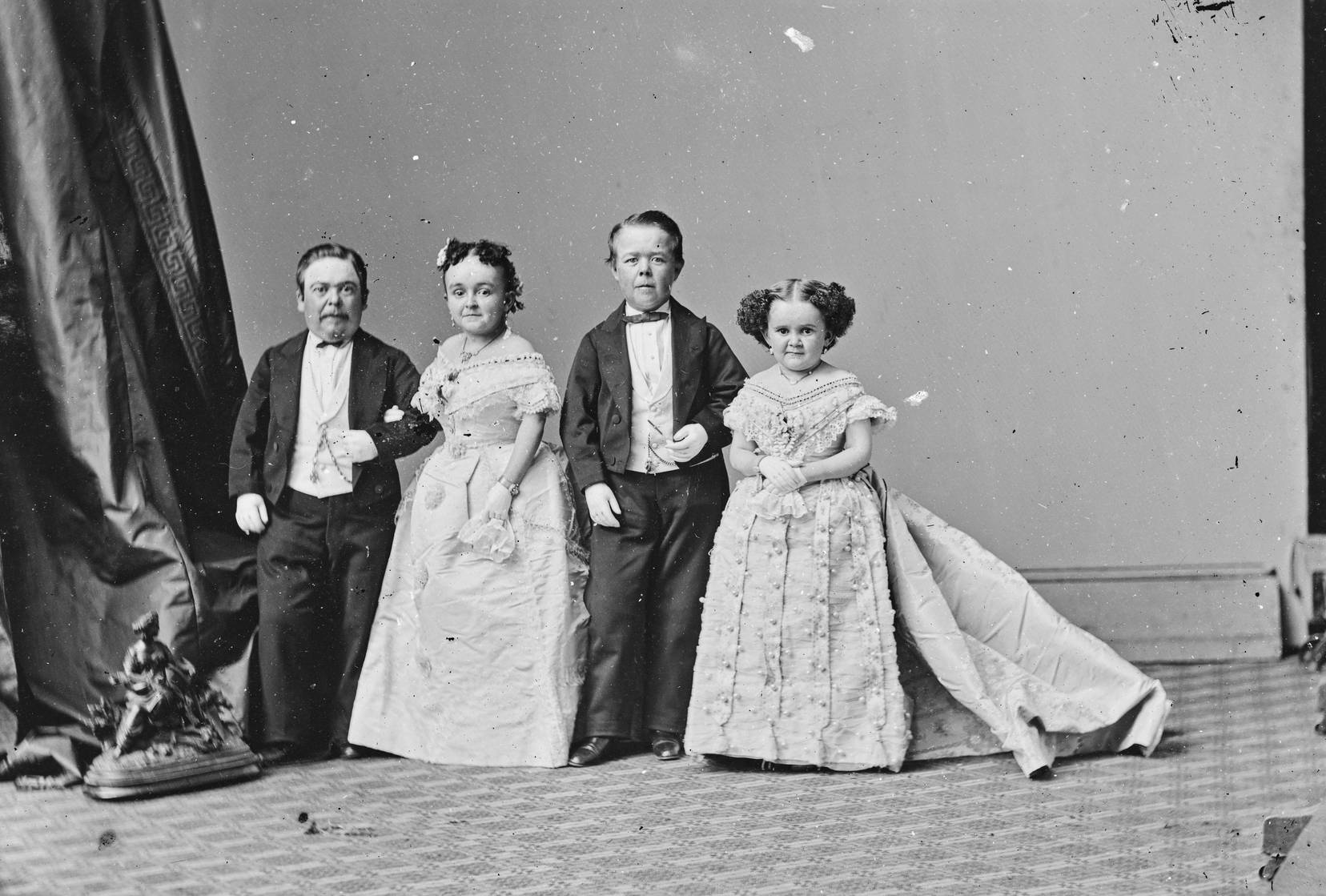 Strattons, G.W.M. Nutt, and Minnie Warren in formal clothes