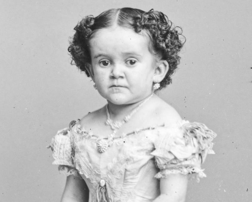 Minnie Warren in white dress