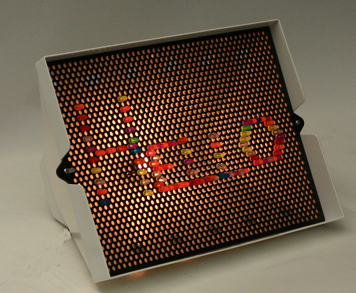 Close Up Photo of Lite-Brite Toy with Hello on it