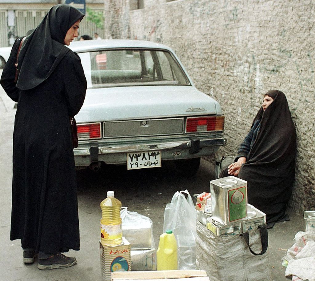 woman sells oil on the blackmarket