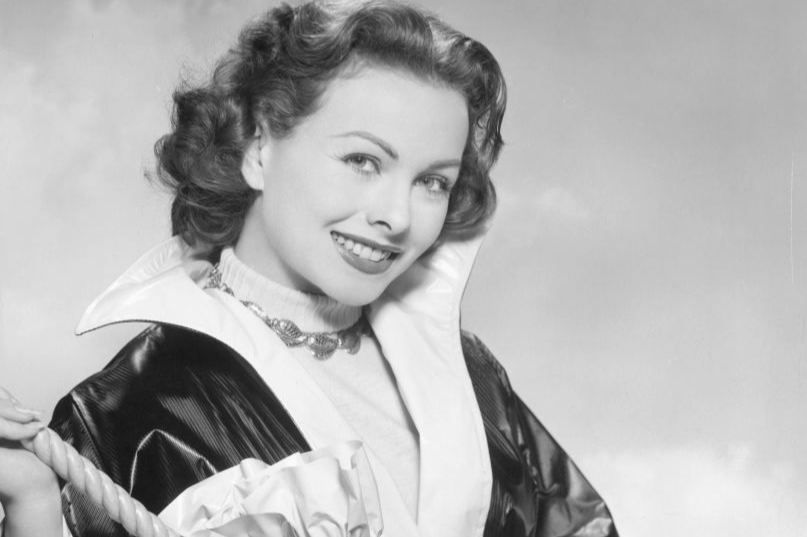 Jeanne Crain with a new type of plastic raincoat
