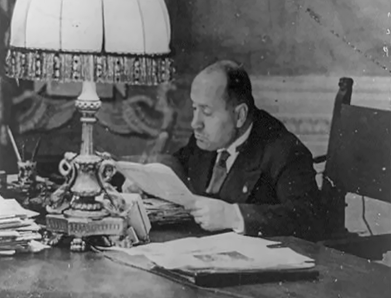 Mussolini at a desk