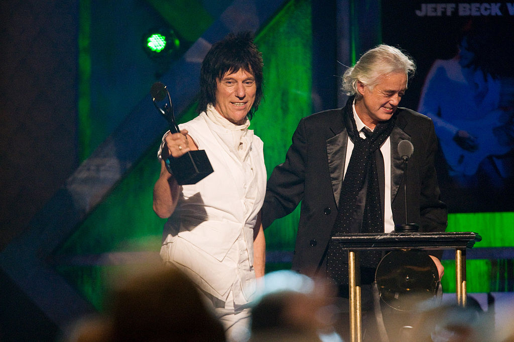 Jeff Beck (L) is inducted by Jimmy Page