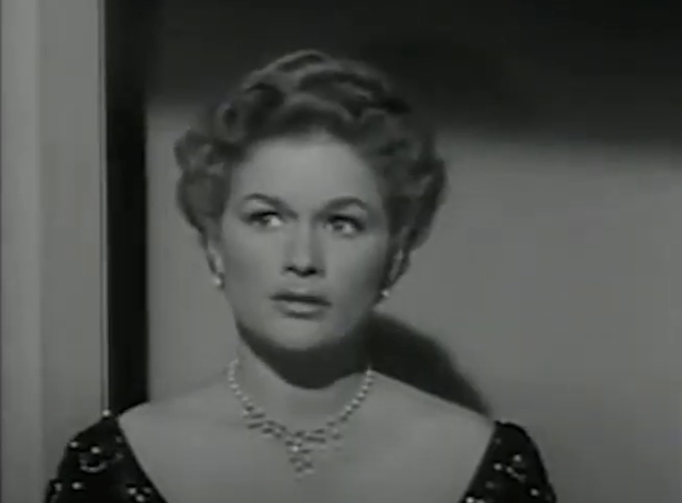 Screenshot of Jean Hagen looking upset - from Spring Reunion (1956)