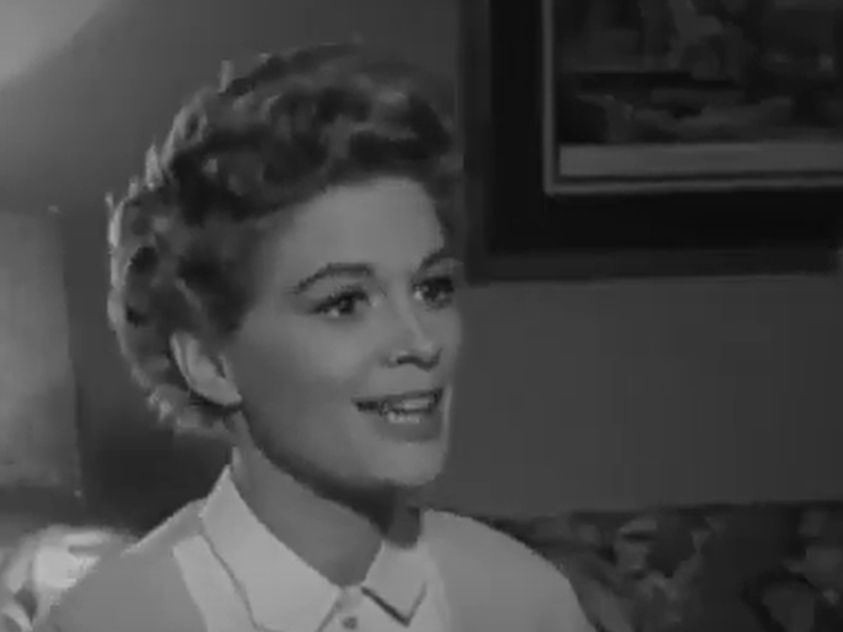 Screenshot of Jean Hagen looking at side and smiling  - from Half a Hero (1953)