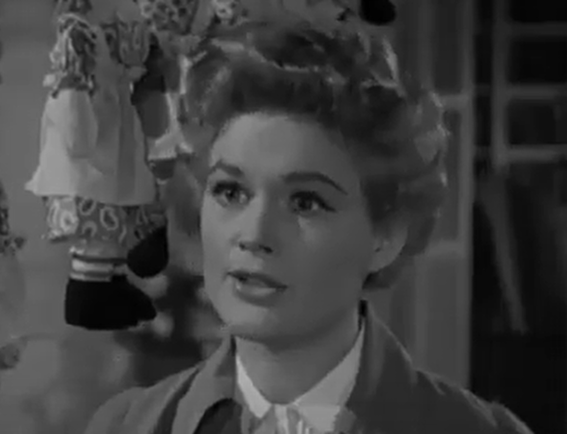 Screenshot of Jean Hagen looking at side - from Half A Hero (1953)