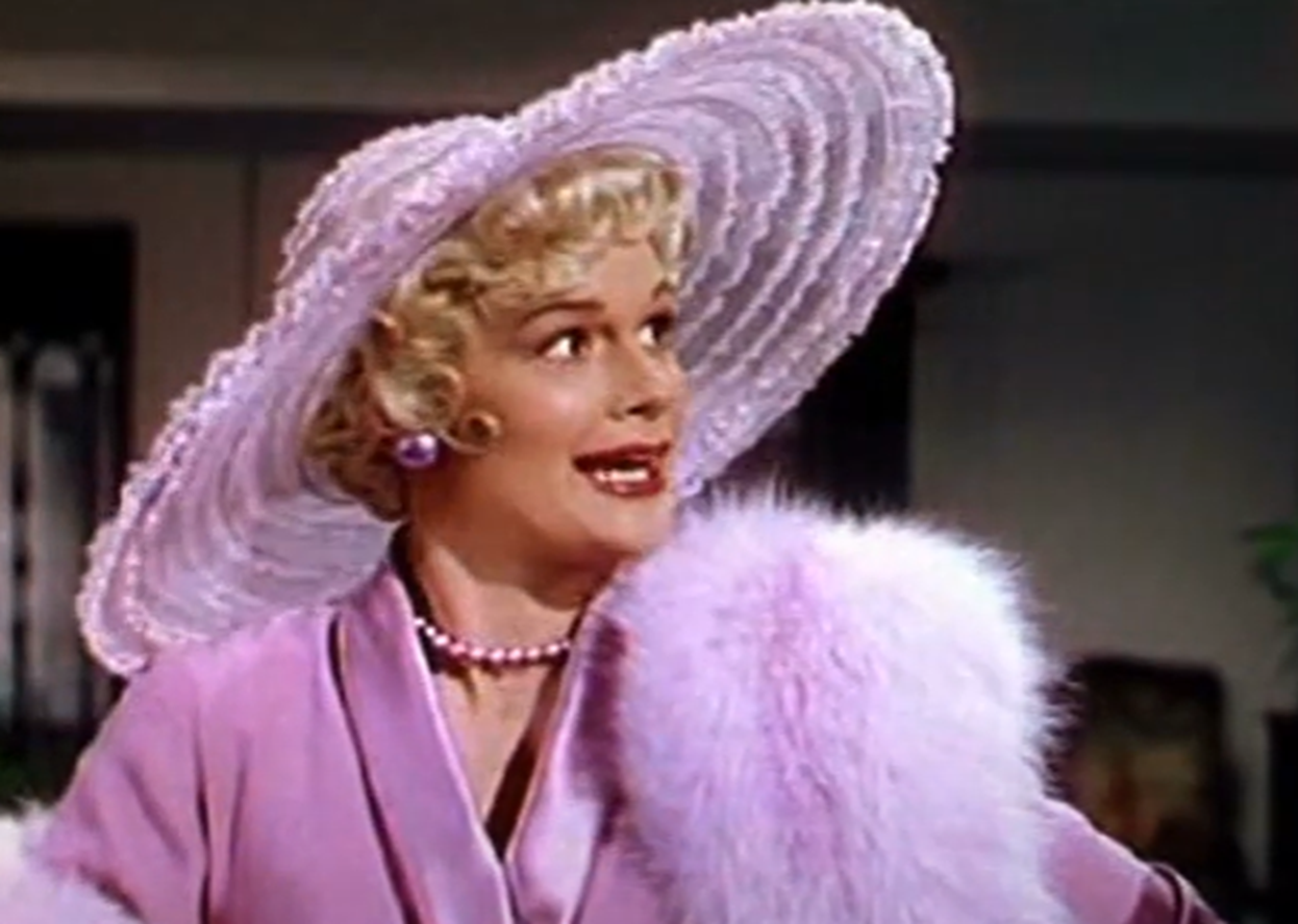 Screenshot of Jean Hagen looking at side in pink clothes - from Singin' In The Rain (1952)