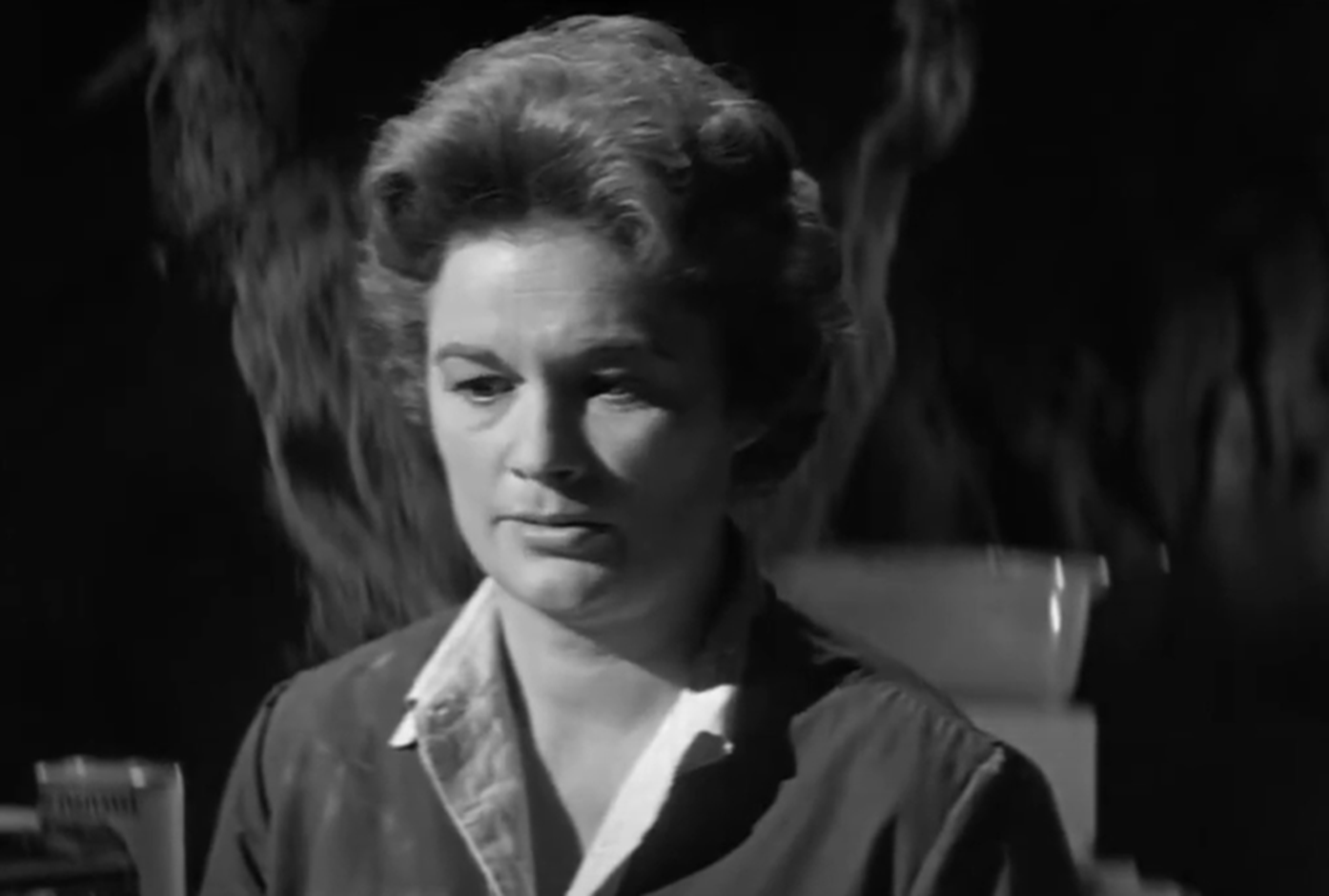 Screenshot of Jean Hagen seating looking sad - from Panic in Year Zero (1962)