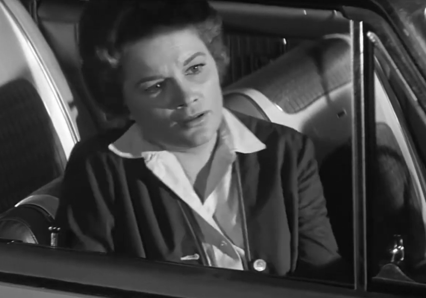 Screenshot of Jean Hagen seating sad in the car - from Panic in Year Zero (1962)