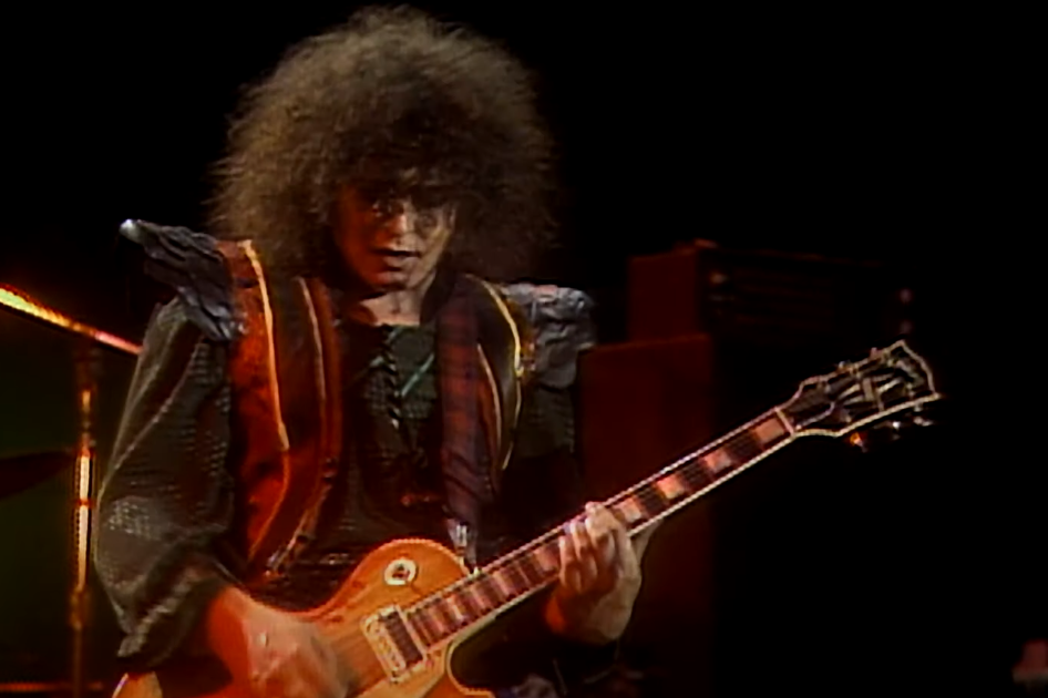 portrait of Marc bolan playing guitar