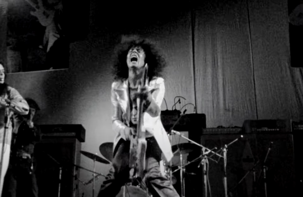 portrait of Marc bolan playing guitar