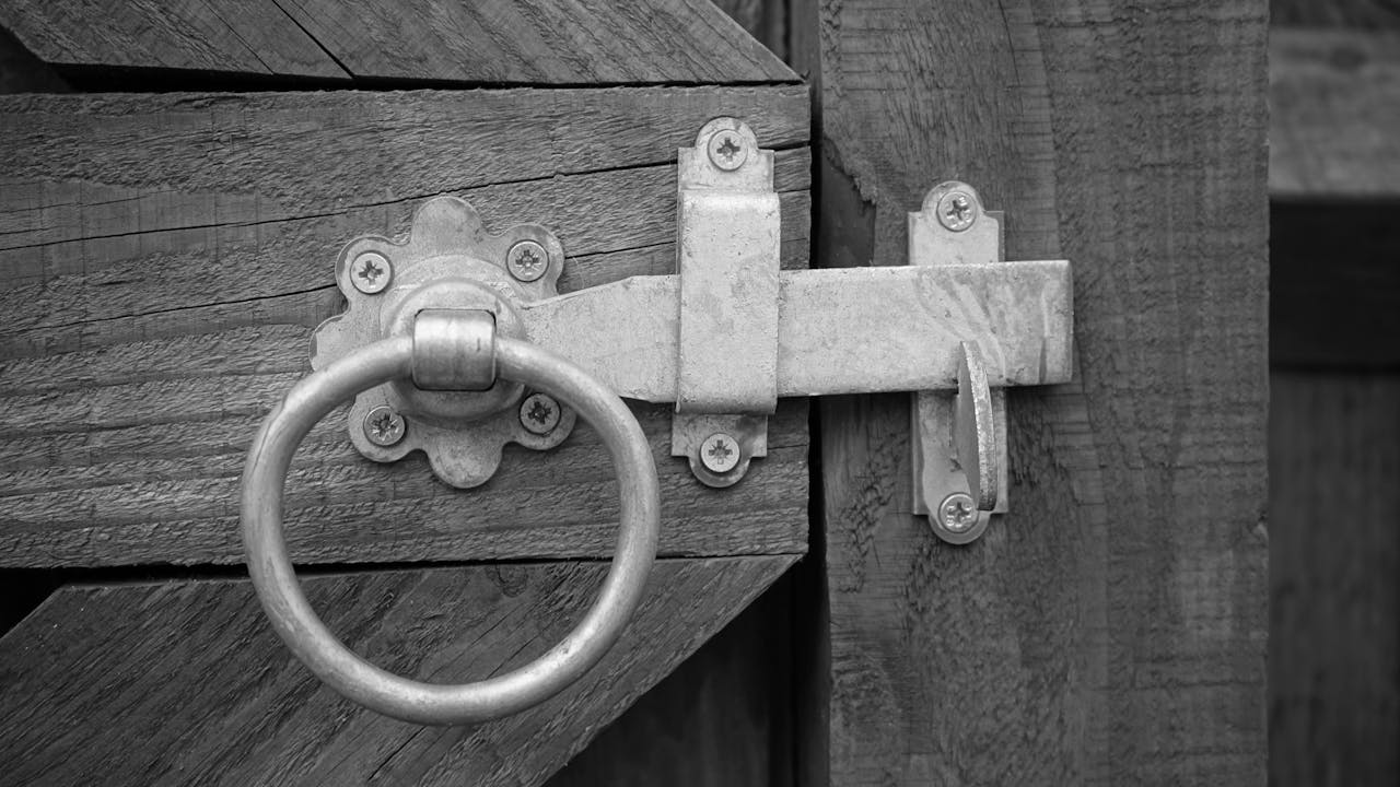 Grayscale Photo of Door Knock
