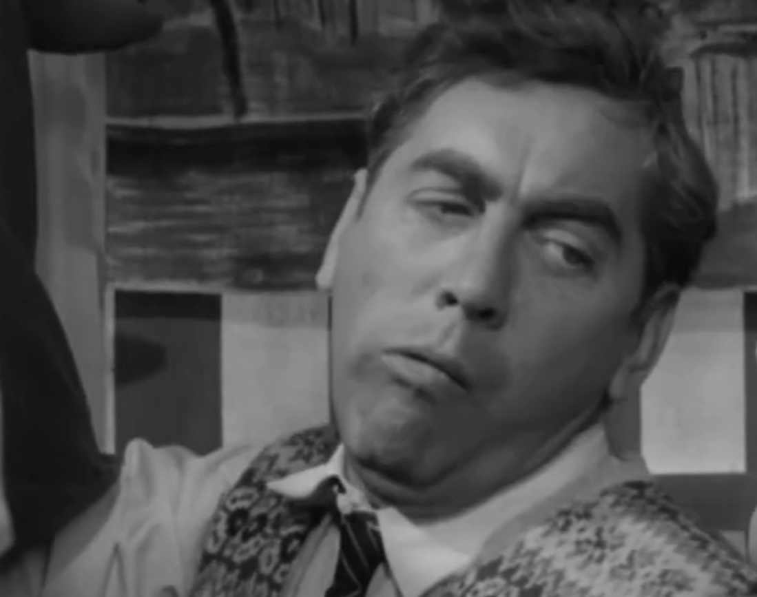 Screenshot of Tony Hancock looking back - from The Punch and Judy Man (1963)