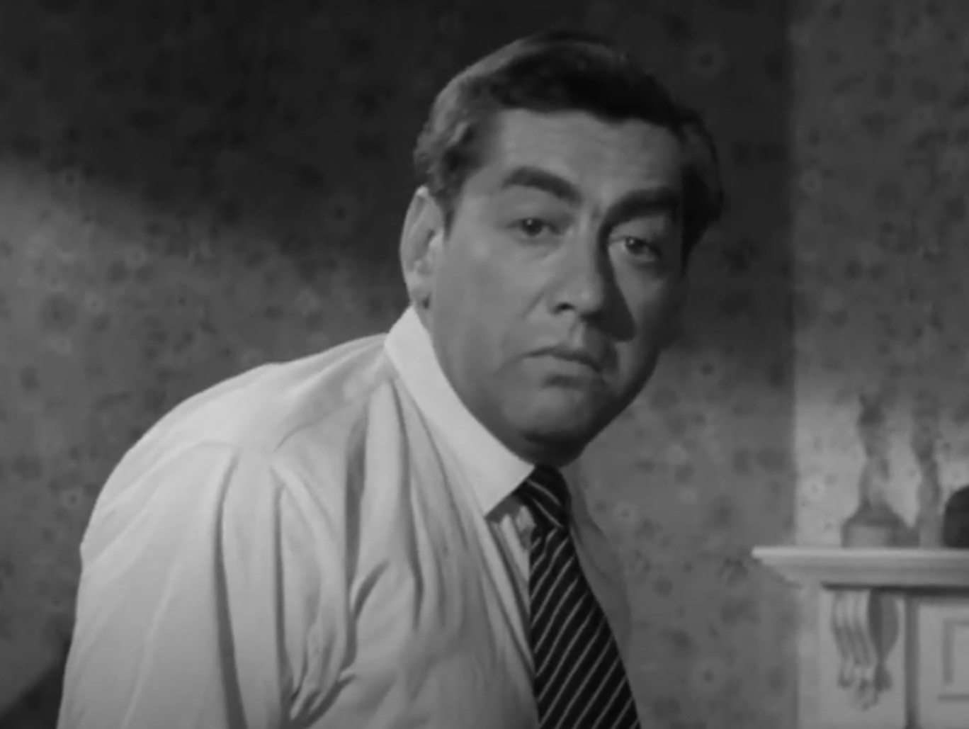 Screenshot of Tony Hancock looking at camera - from The Punch and Judy Man (1963)