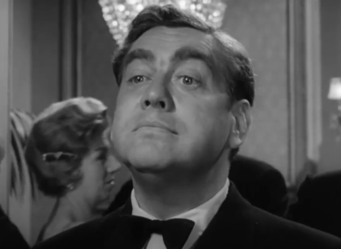 Screenshot of Tony Hancock looking at front  - from The Punch and Judy Man (1963)