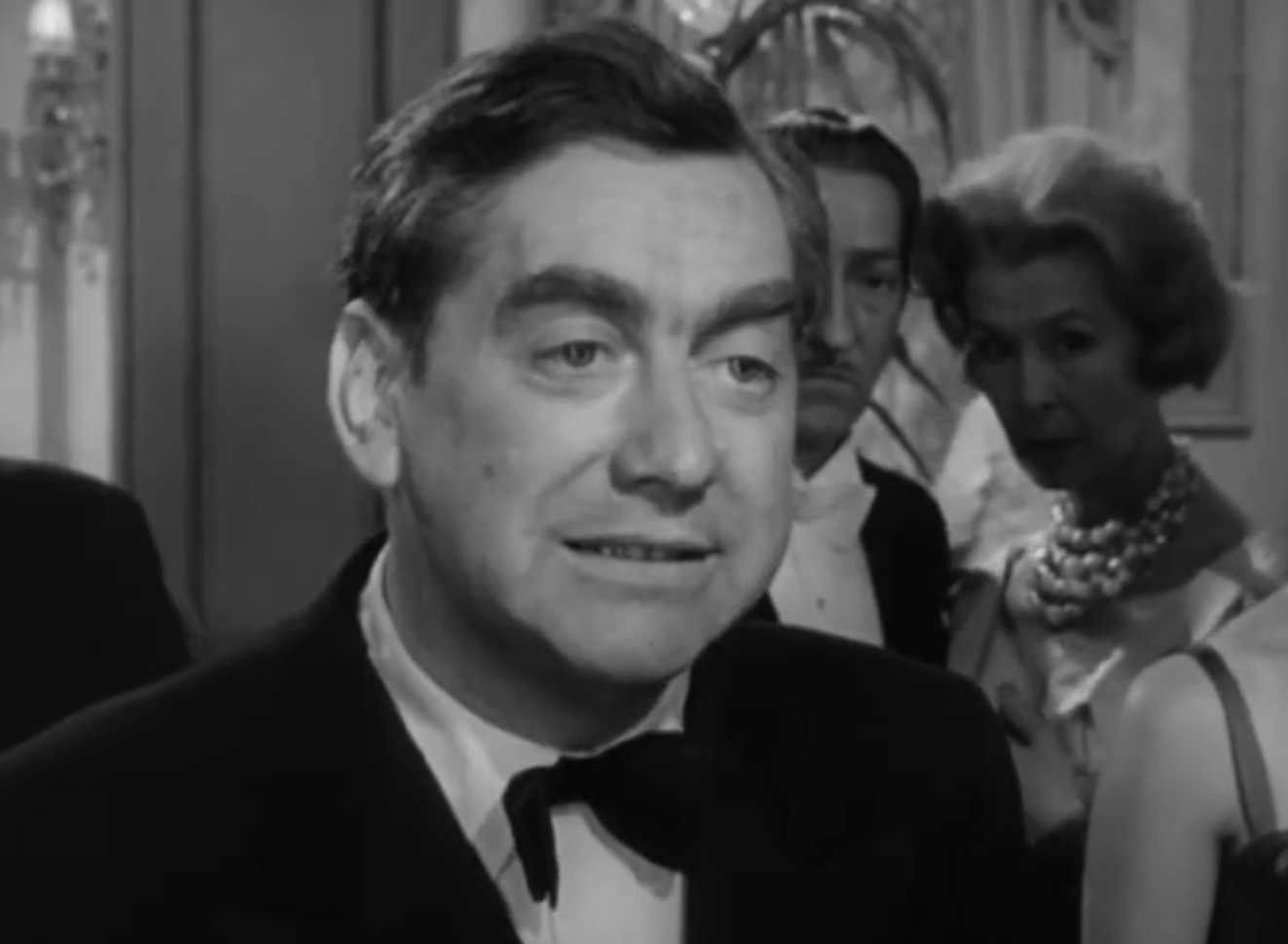 Screenshot of Tony Hancock looking at side - from The Punch and Judy Man (1963)
