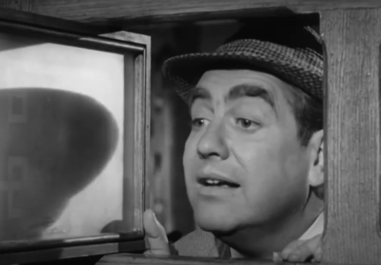 Screenshot of Tony Hancock looking at side - from The Punch and Judy Man (1963)