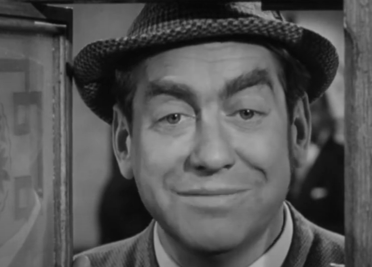 Screenshot of Tony Hancock looking at camera - from The Punch and Judy Man (1963)