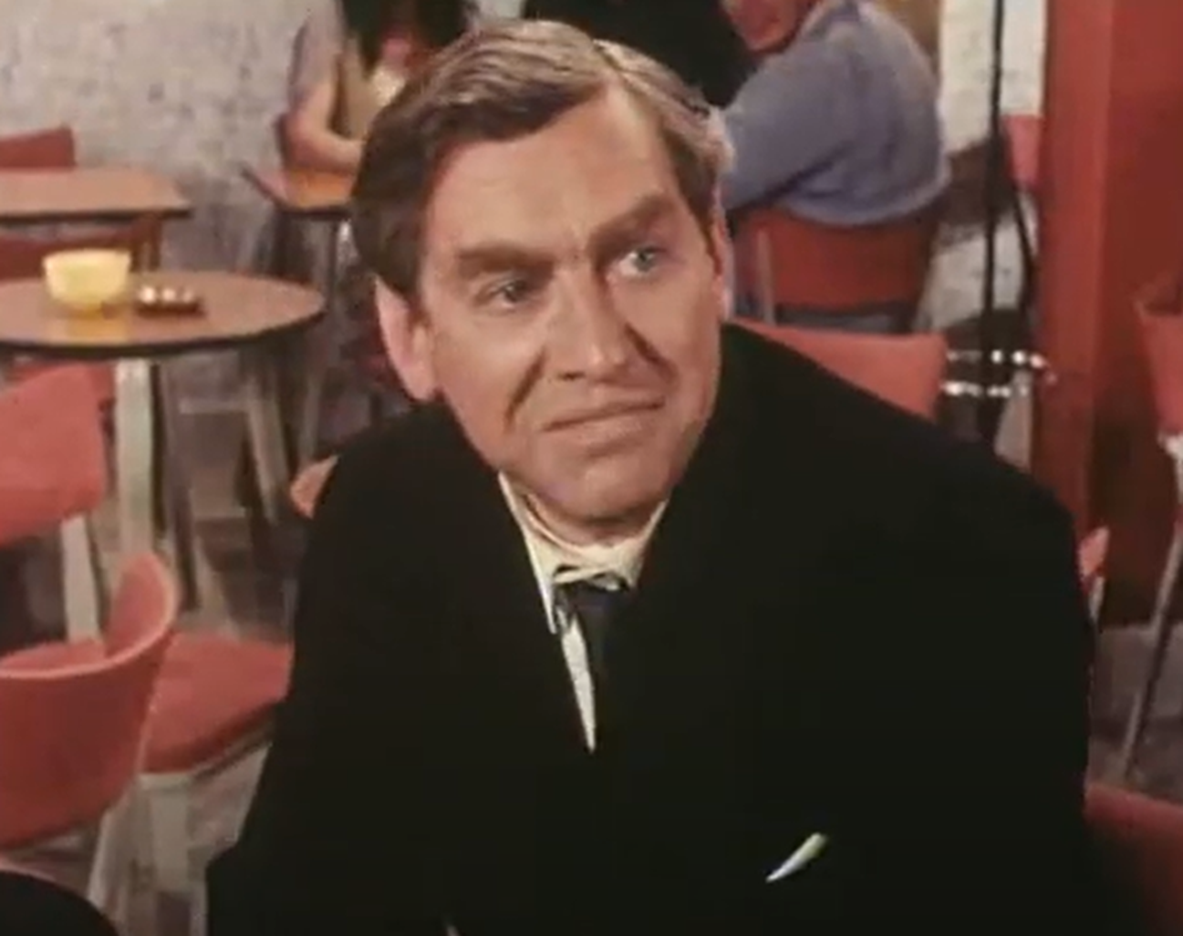 Screenshot of Tony Hancock looking at side  - from The Rebel (1961)