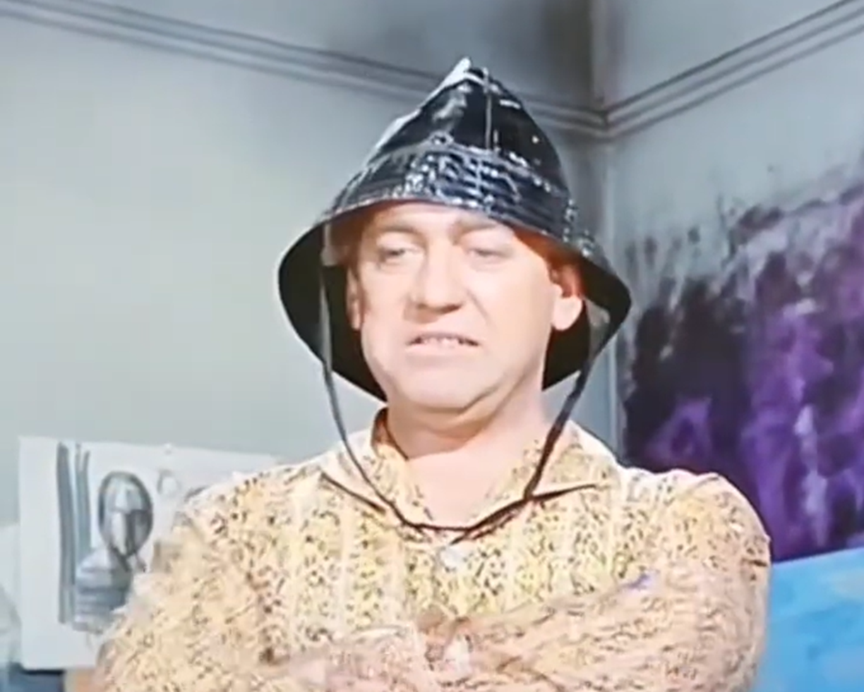 Screenshot of Tony Hancock in bird costume - from The Rebel (1961)