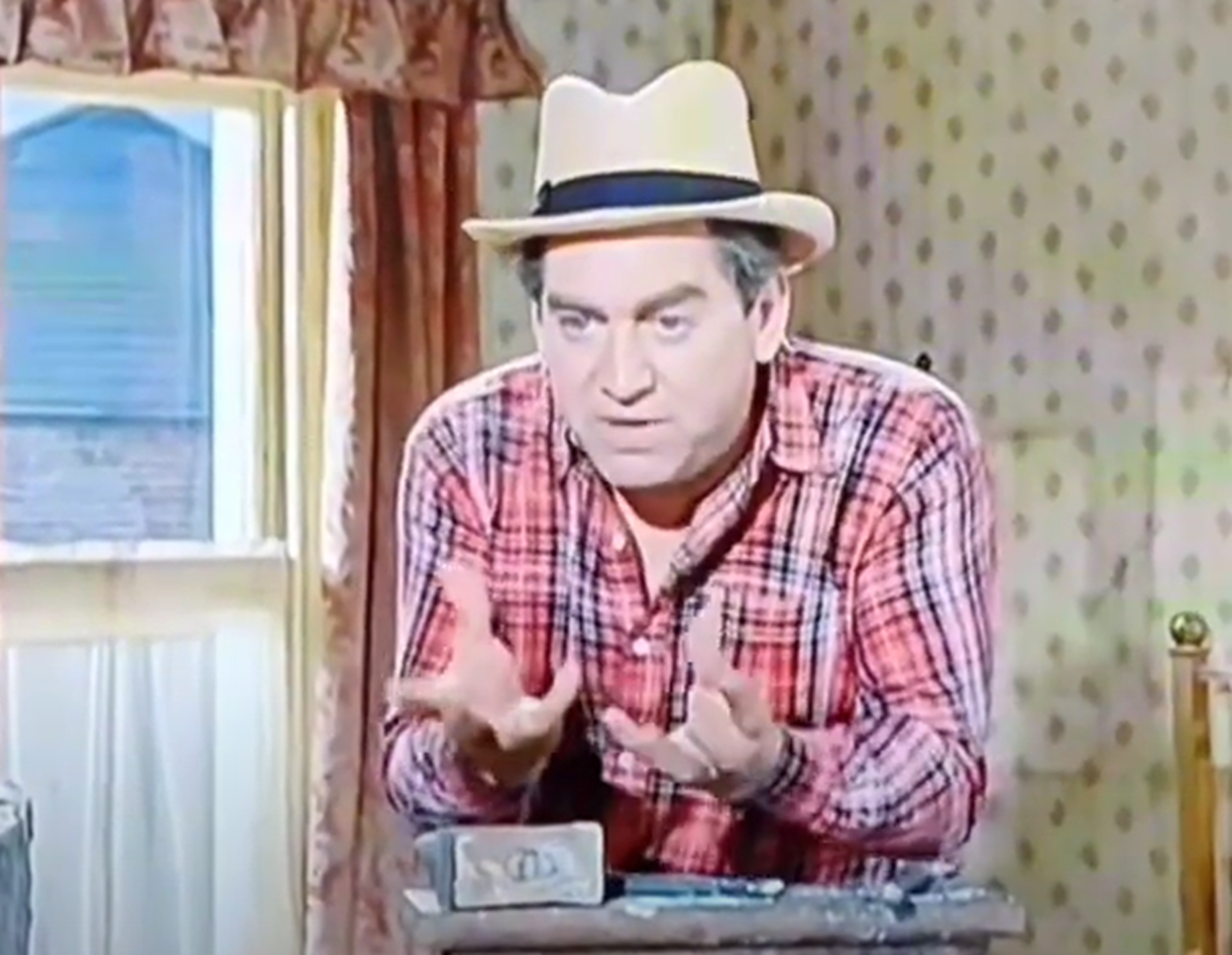 Screenshot of Tony Hancock looking at camera  - from The Rebel (1961)