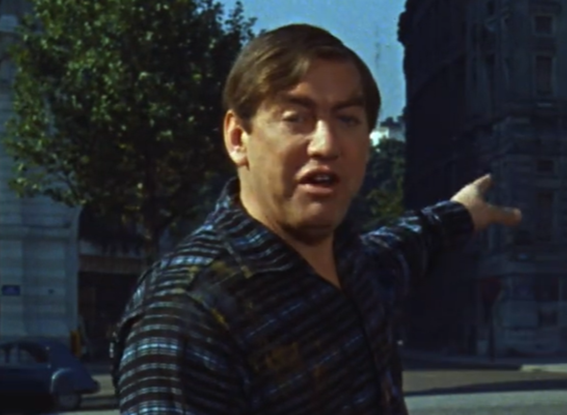 Screenshot of Tony Hancock pointing outside - from The Rebel (1961)
