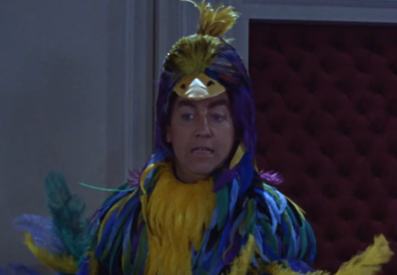 Screenshot of Tony Hancock in bird costume - from The Rebel (1961)