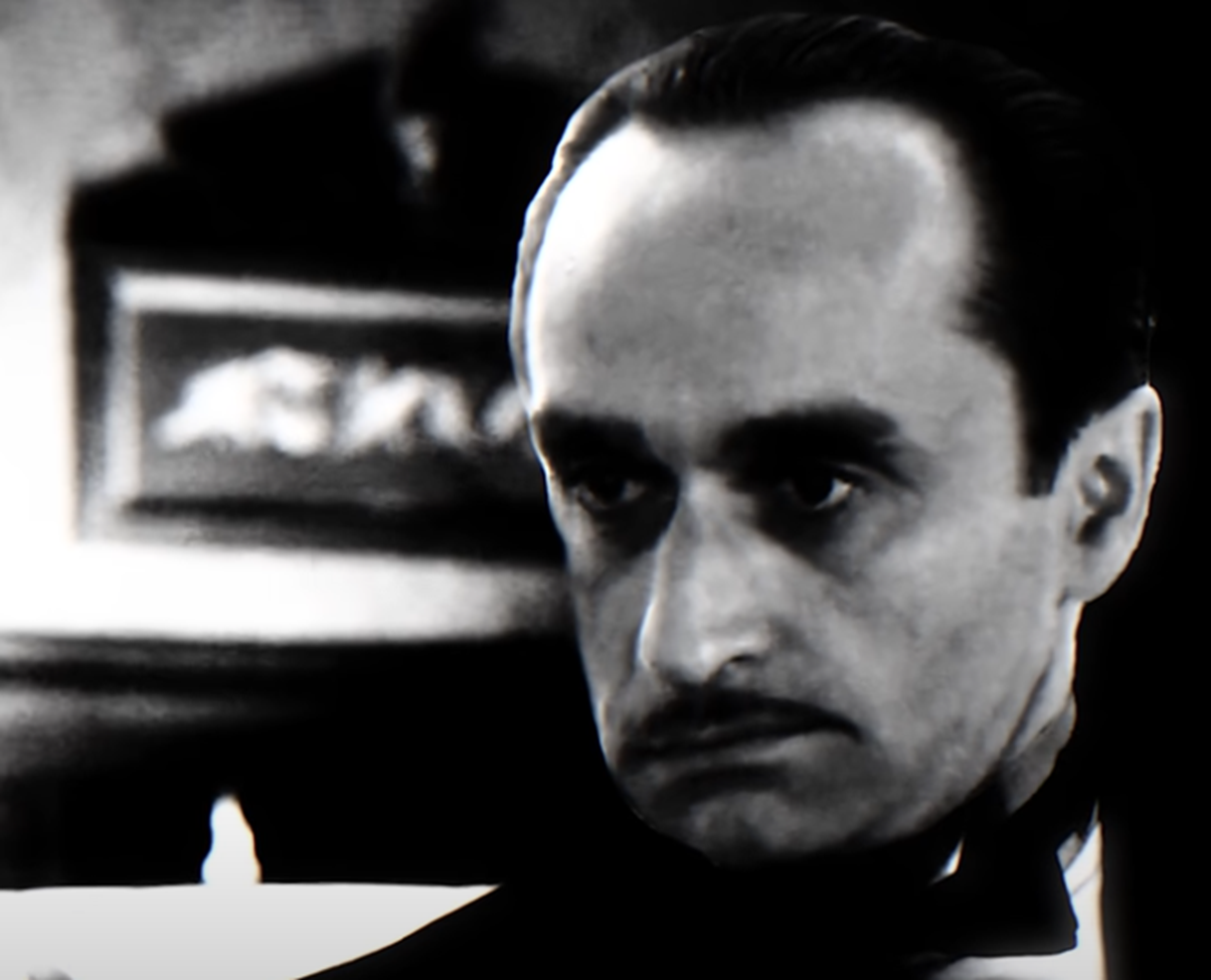 Screenshot of John Cazale looking at front from The Godfather Part II (1974)