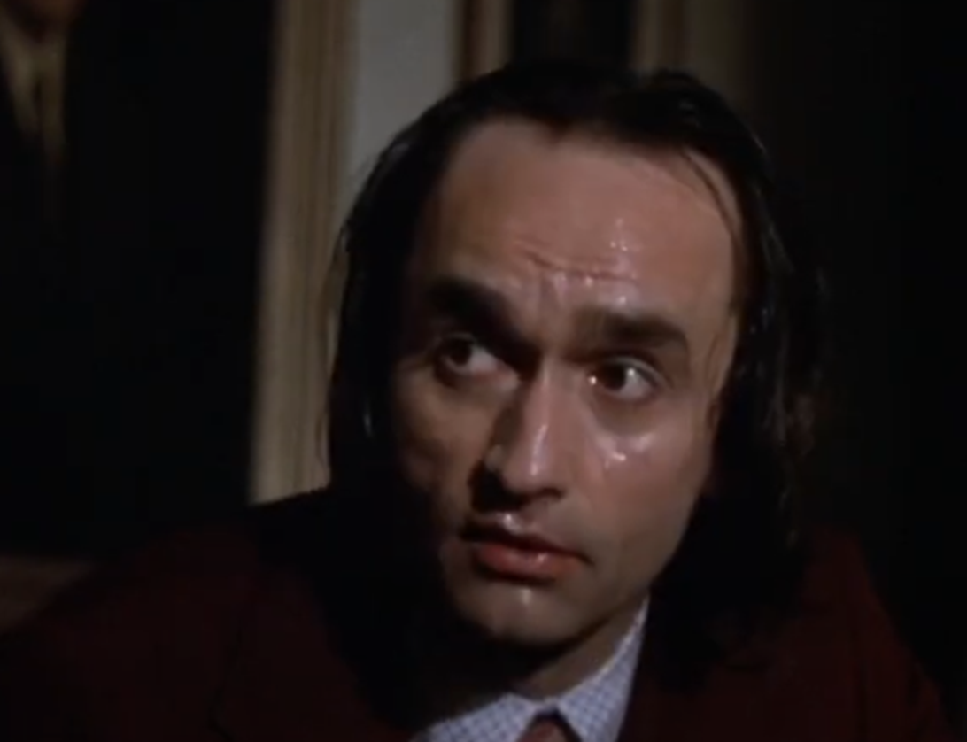 Screenshot of John Cazale looking at side scared from - Dog Day Afternoon (1975)
