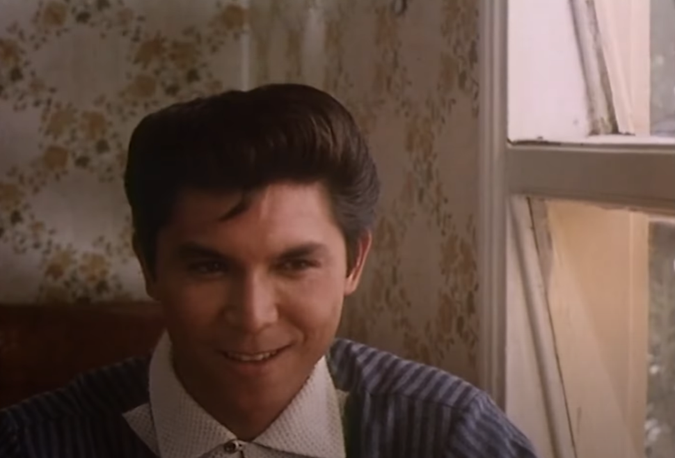 Lou Diamond Phillips as Ritchie Valens in La Bamba traveling by plane in snow storm