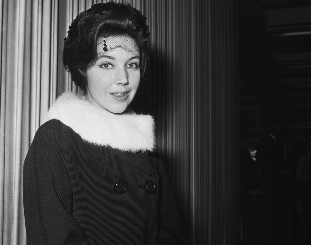 Hope Cooke in black coat