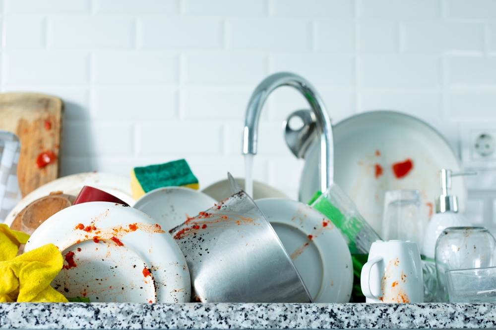 washing dirty dishes at home