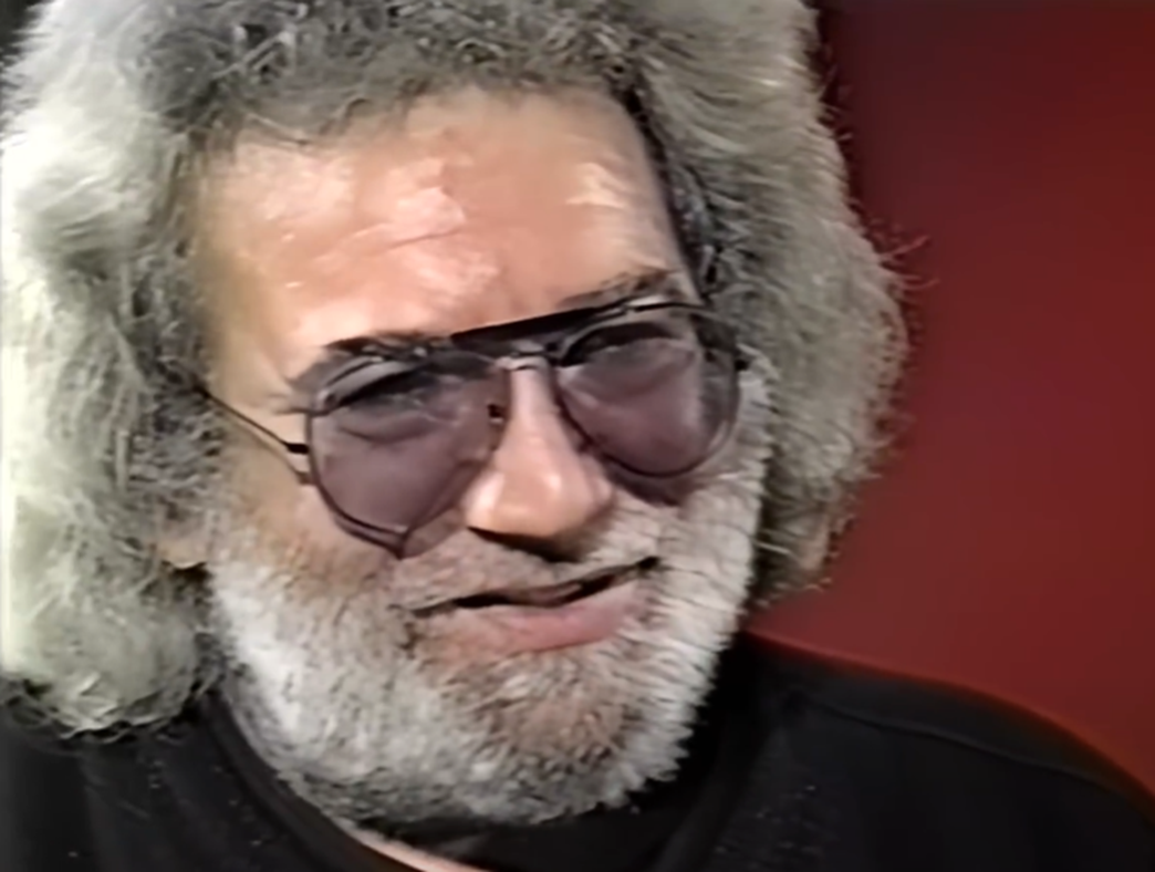 Screenshot of Jerry Garcia talking  - from Entertainment Tonight (Tv Series)