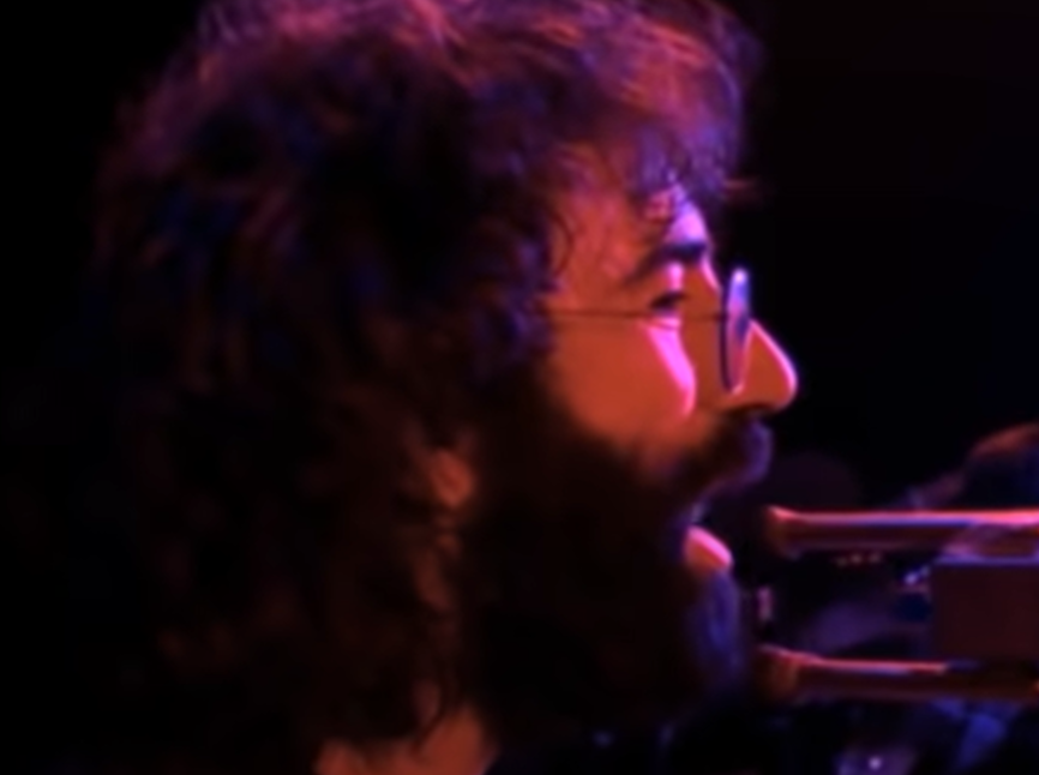 Screenshot of Jerry Garcia on stage - from The Grateful Dead (1977)