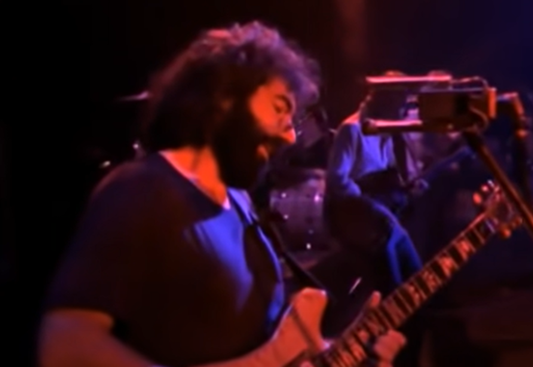 Screenshot of Jerry Garcia on stage - from The Grateful Dead (1977)