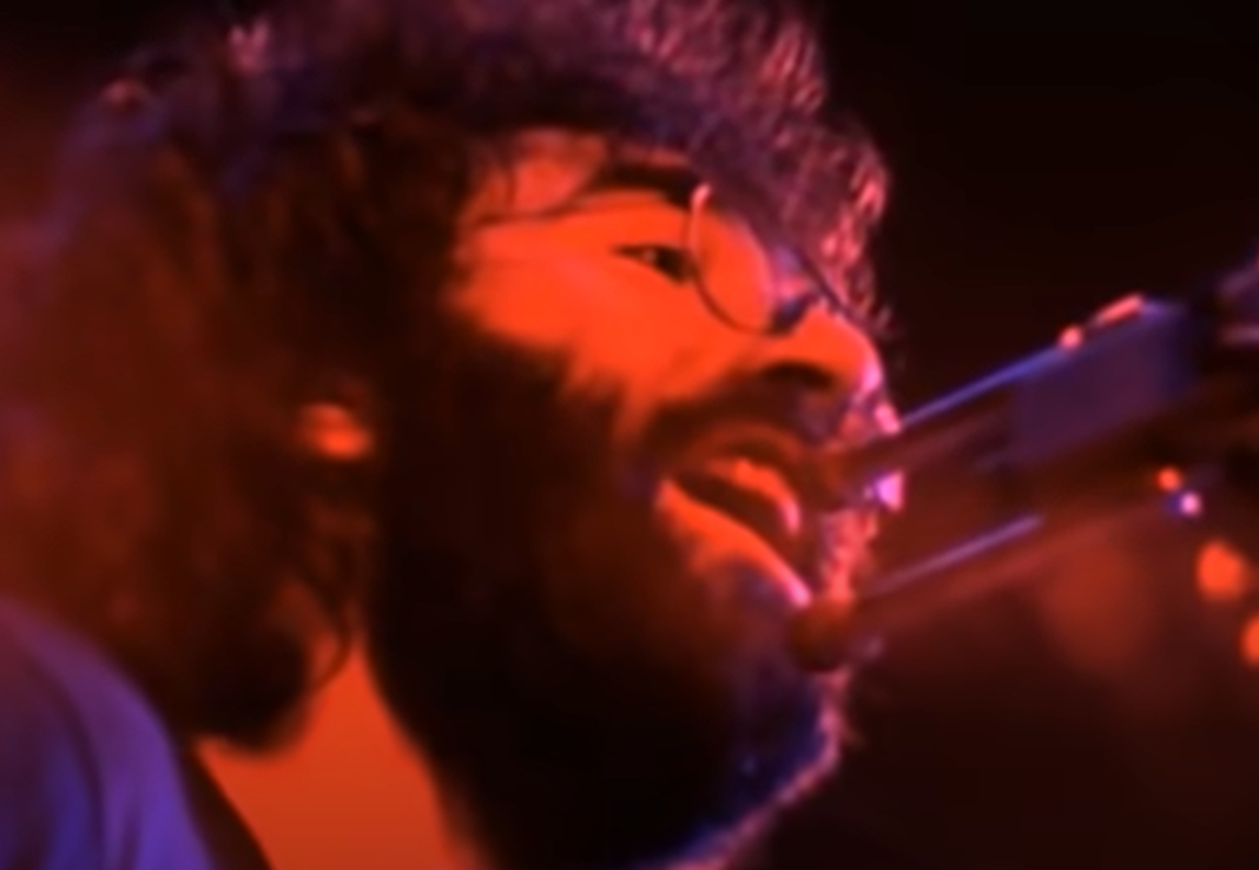 Screenshot of Jerry Garcia on stage - from The Grateful Dead (1977)