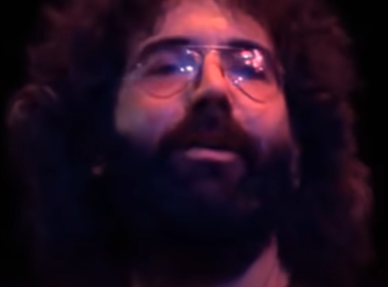 Screenshot of Jerry Garcia on stage - from The Grateful Dead (1977)