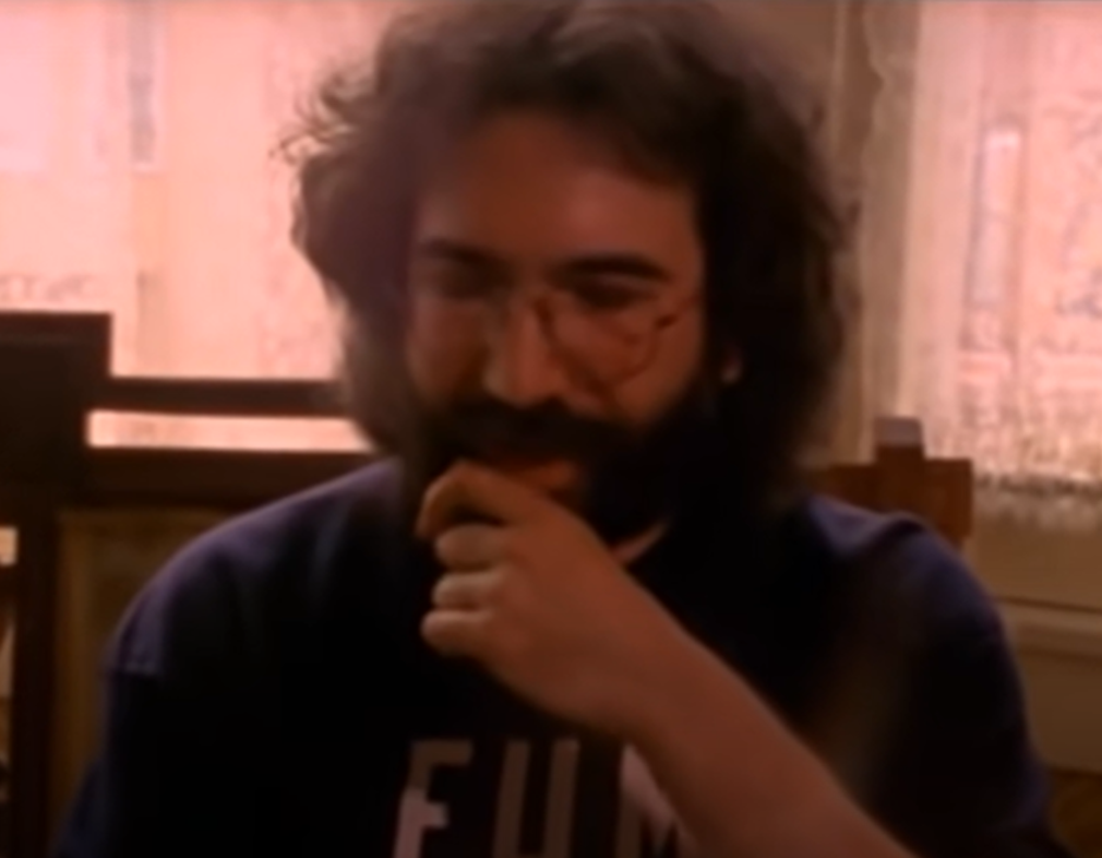 Screenshot of Jerry Garcia looking at front - The Grateful Dead (1977)