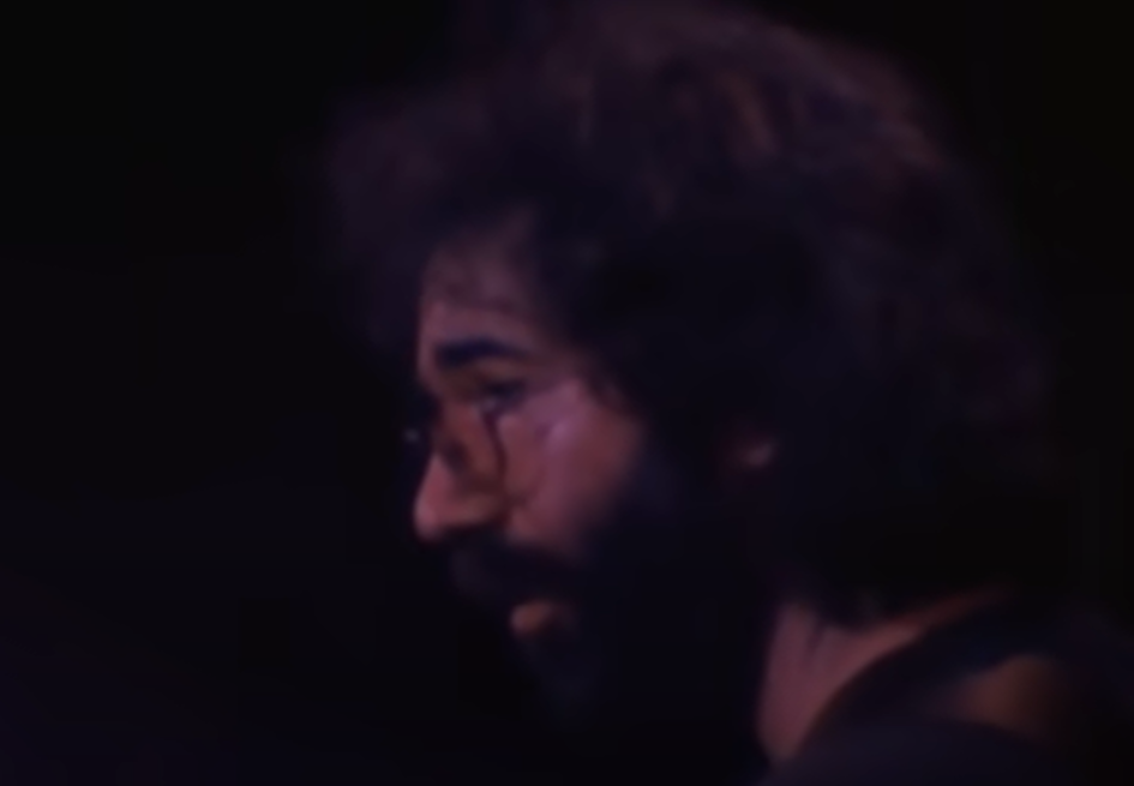 Screenshot of Jerry Garcia on stage - from The Grateful Dead (1977)