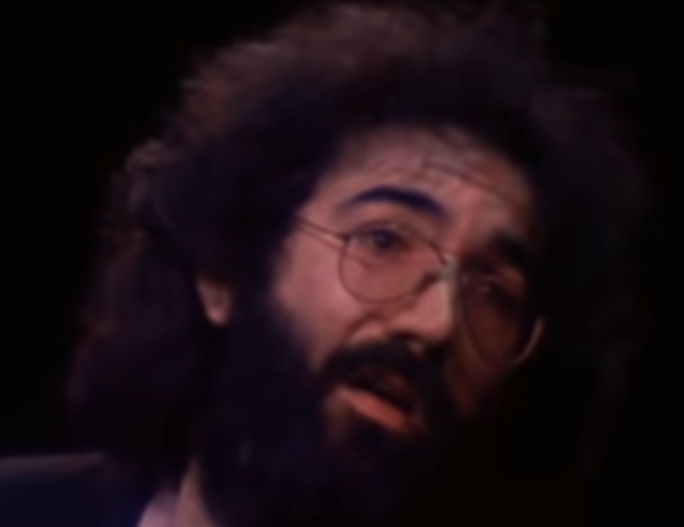 Screenshot of Jerry Garcia looking sad - from The Grateful Dead (1977)