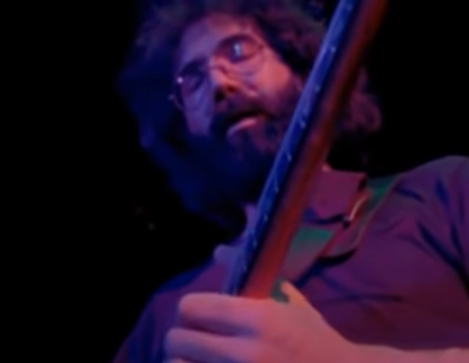 Screenshot of Jerry Garcia on stage - from The Grateful Dead (1977)
