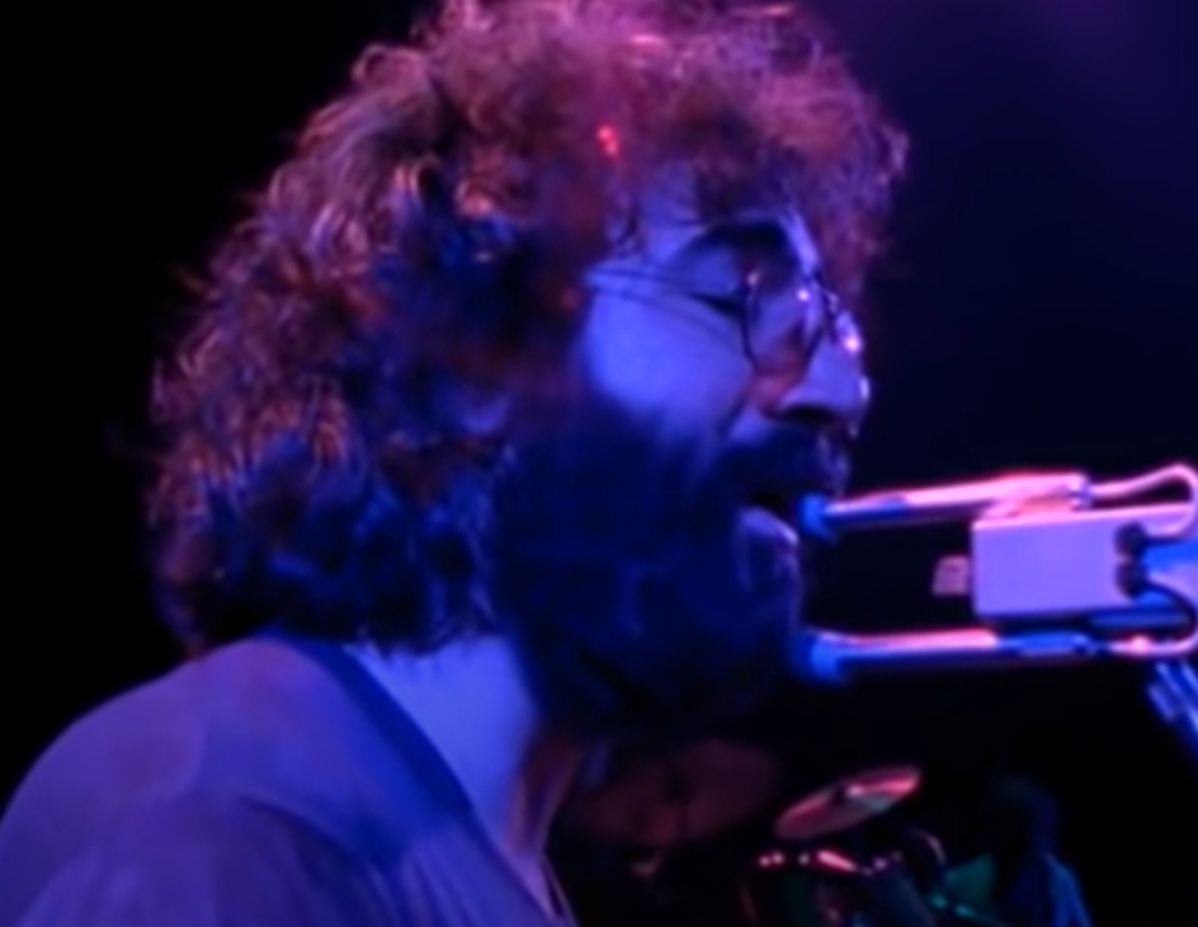 Screenshot of Jerry Garcia on stage - from The Grateful Dead (1977)