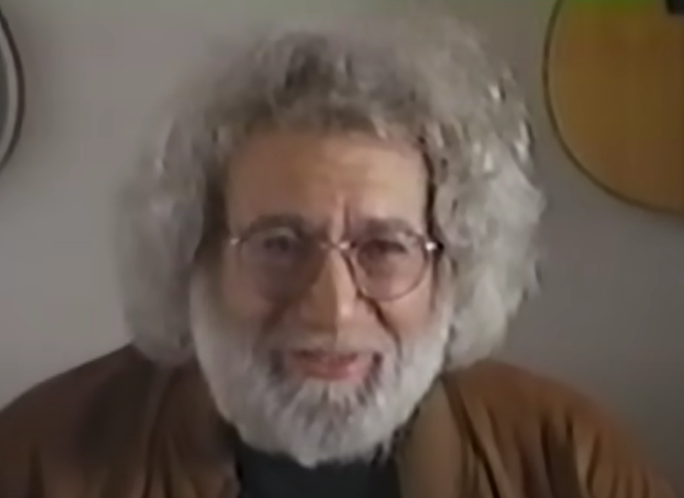 Screenshot of Jerry Garcia looking at camera  - from The History Of Rock 'N' Roll (1995-Mini Series)