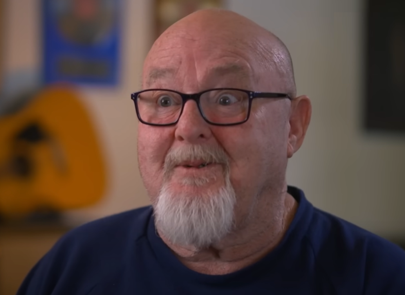 Screenshot of Bruce Howe talking at camera from - On The Brink (2022)