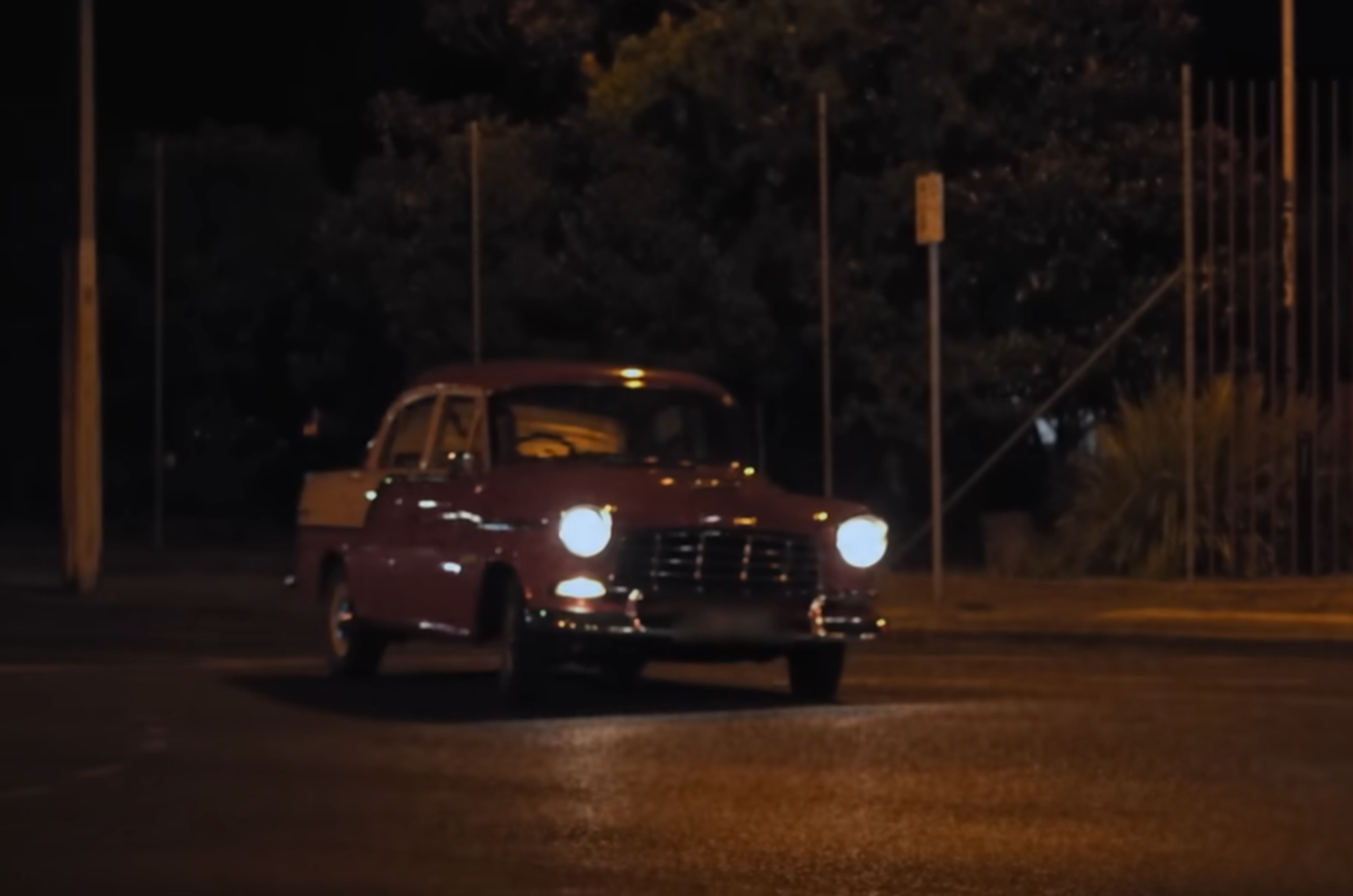 Screenshot of car driving at night from - On The Brink (2022)