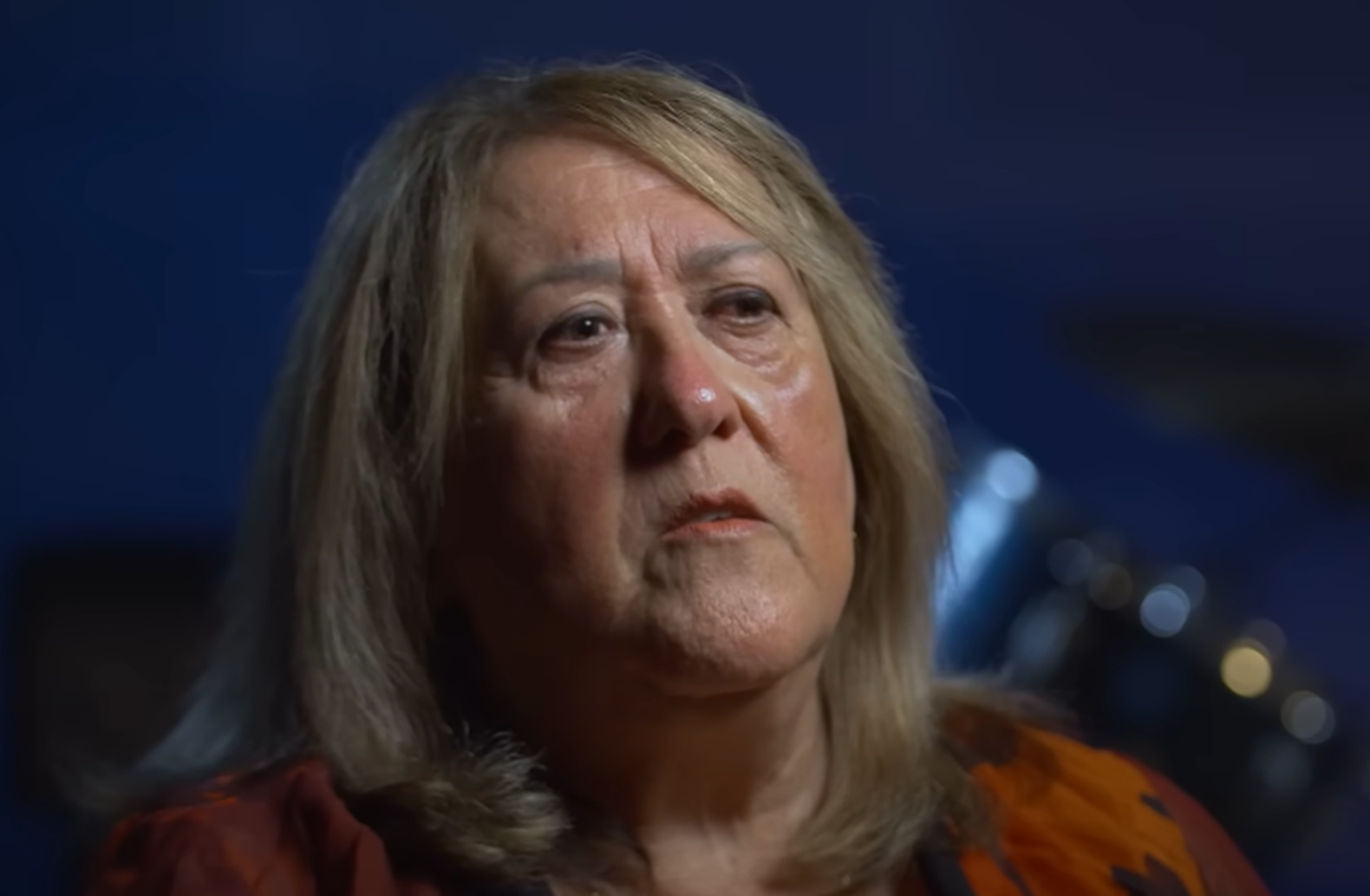 Screenshot of Fifa Riccobono talking on camera - from On The Brink (2022)