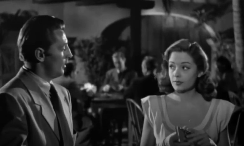 Jane Greer and Robert Mitchum in a cafe scene