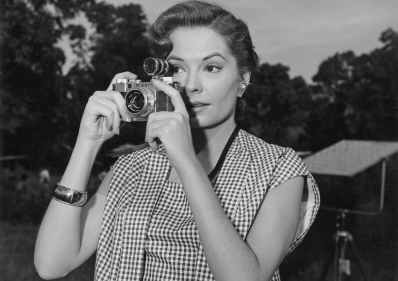 American actress Jane Greer taking a photo