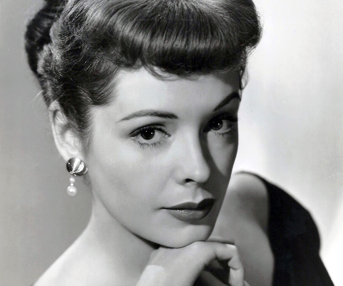 Publicity photo of Jane Greer in the 1940s in black dress