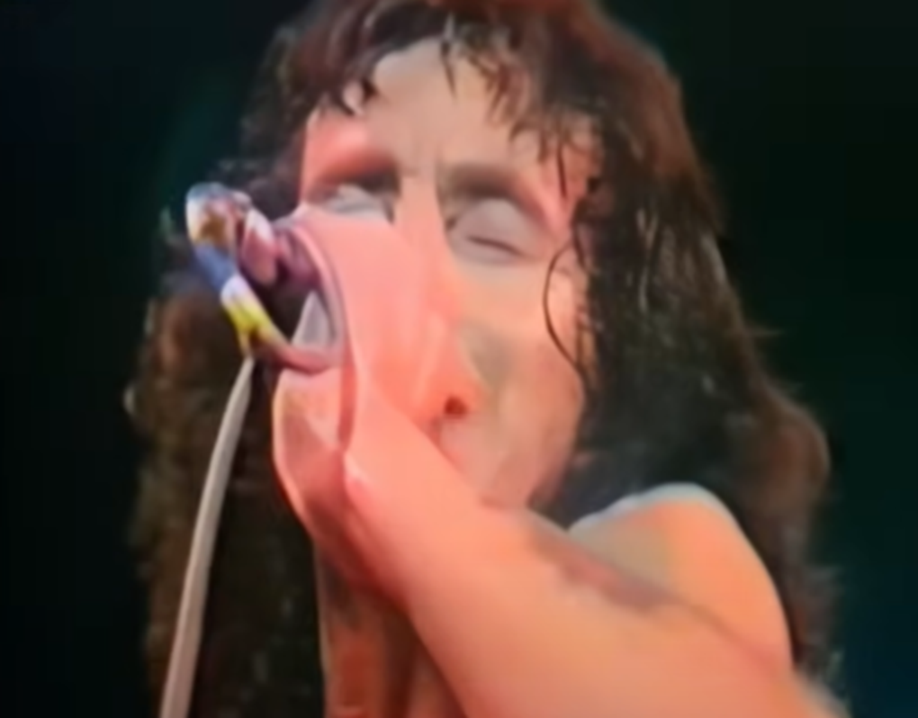 Screenshot of Bonn Scott performing on stage from - AC/DC: The Bon Scott Years (2005)